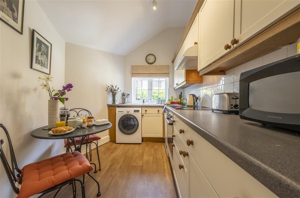 Fully-equipped kitchen with a dishwasher and washer/dryer at The Mews, Goudhurst