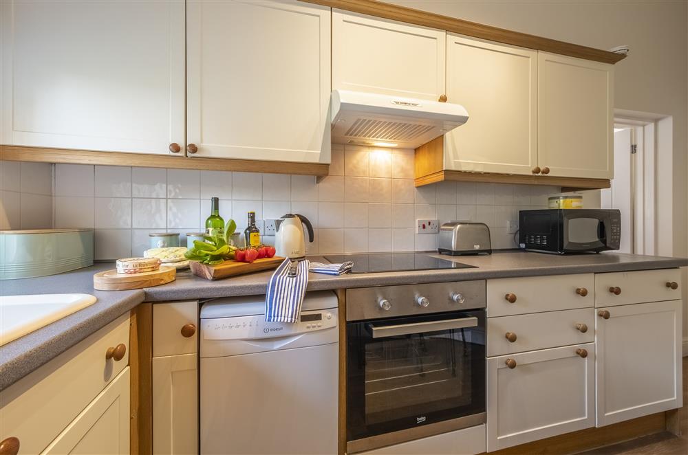 Kitchen with an electric oven and hob at The Mews, Goudhurst