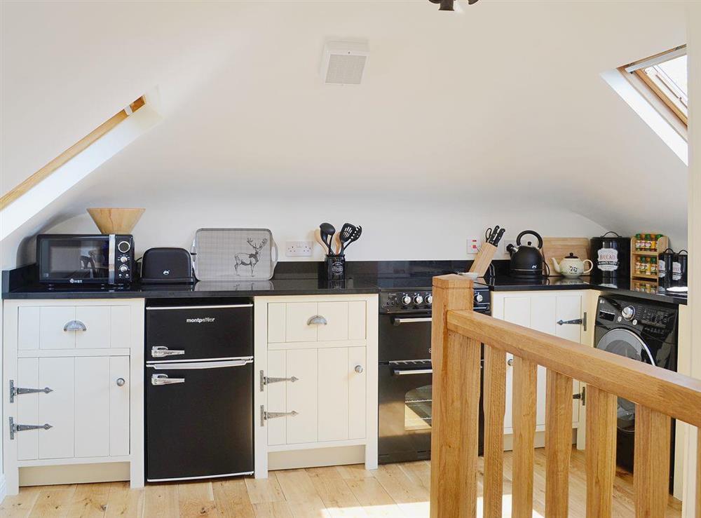 The cottage has a smart and well-fitted kitchen at The Mews in Port Of Menteith, Stirlingshire
