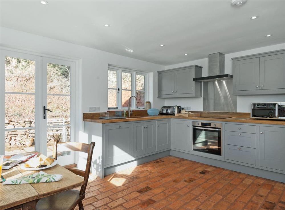 Spacious kitchen/dining room with French doors leading to garden (photo 2) at The Mill House in Aisholt, near Bridgwater, Somerset