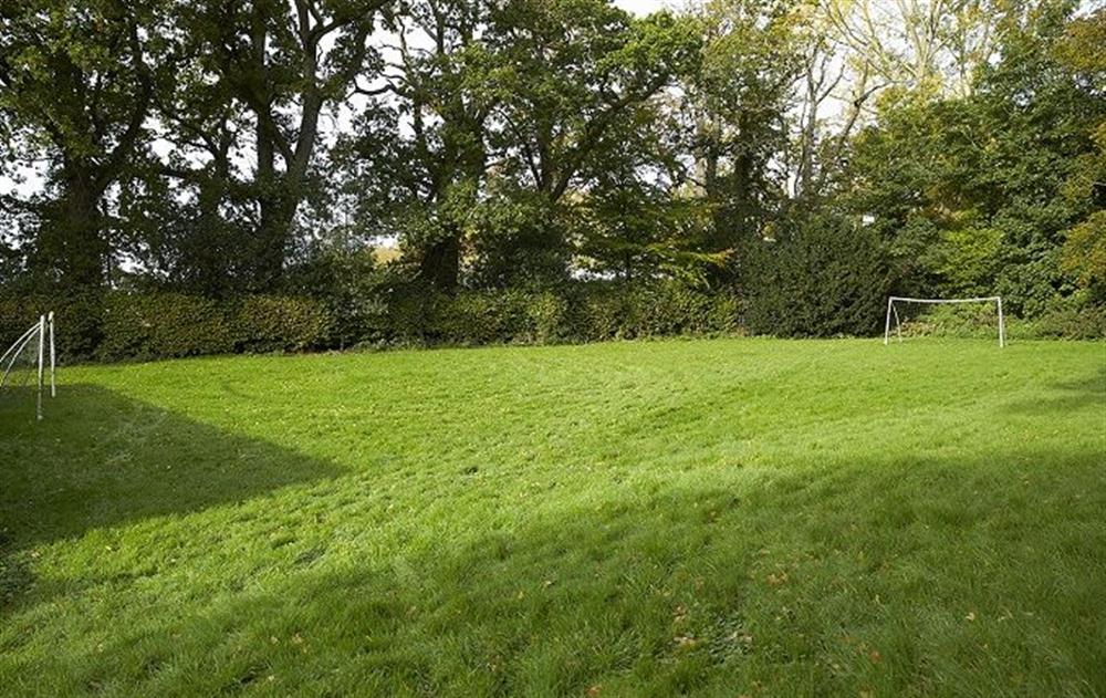 Five acres of grounds including a woodland, ponds, streams and lawns at The Mill House, Buxton with Lamas