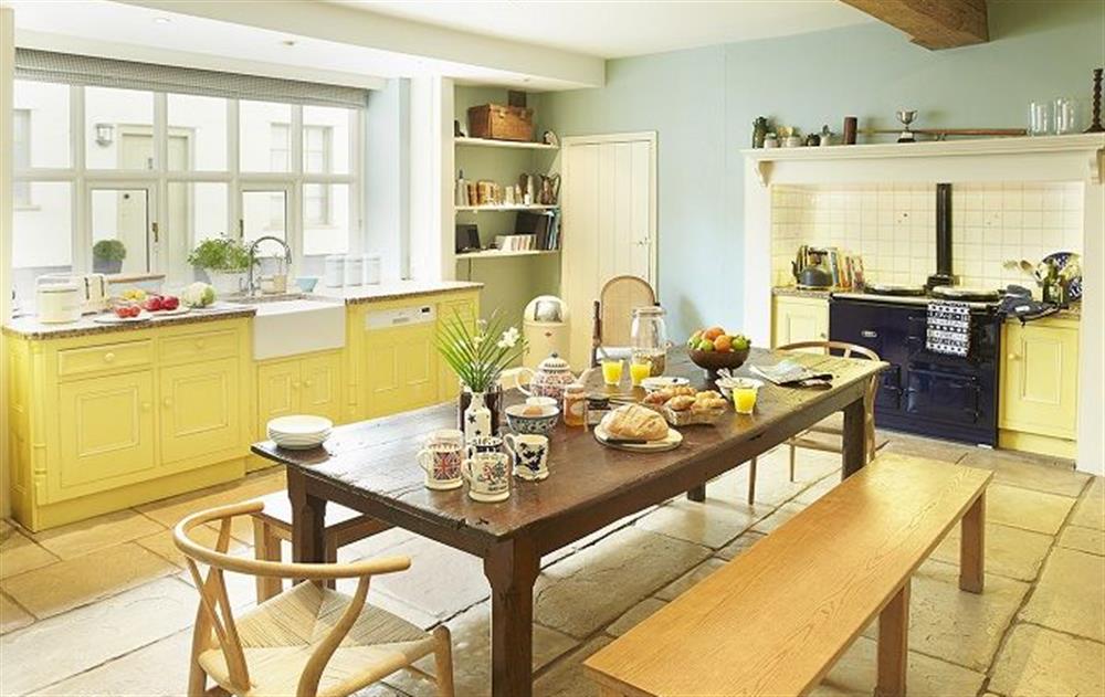 Ground floor: Large farmhouse kitchen with Aga at The Mill House, Buxton with Lamas