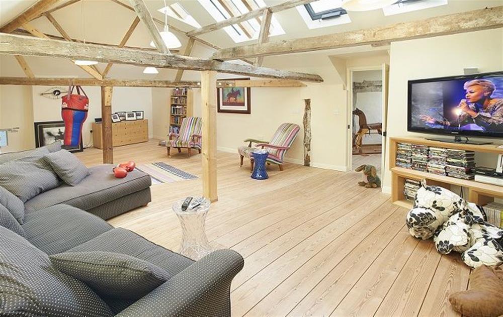 Second floor: Large family entertainment room with table football and adjoining room with weights and a dartboard