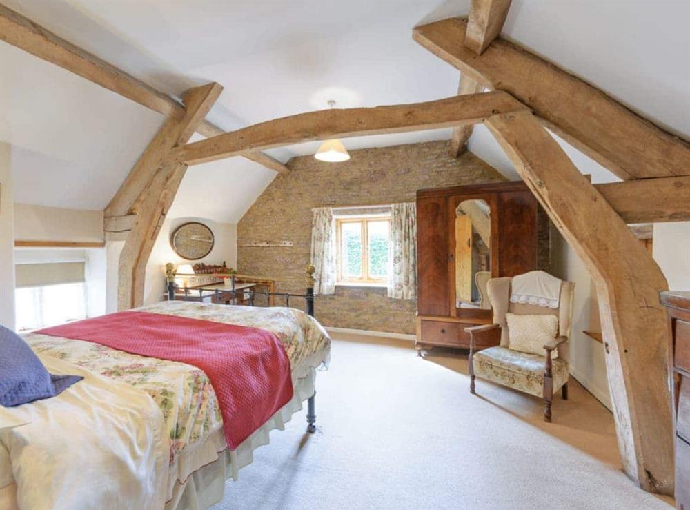 Exposed wooden frame in double bedroom at The Mill House in Lea, near Ross-on-Wye, Herefordshire