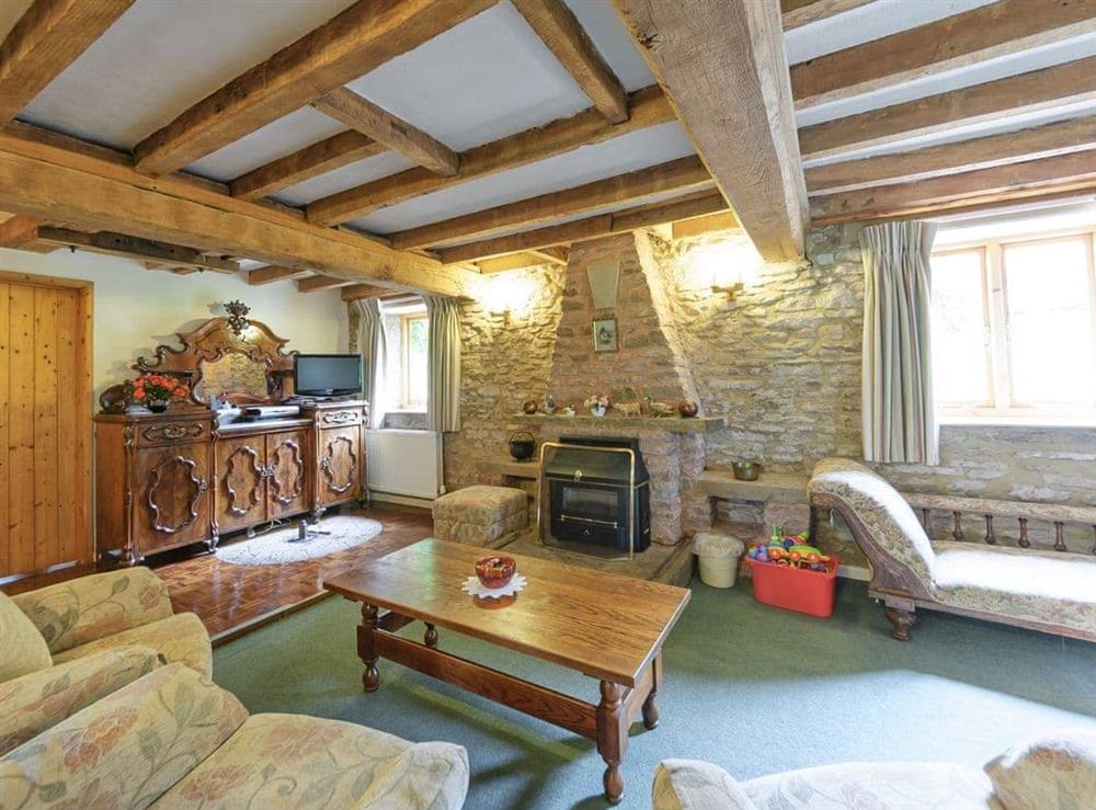 Lovely living room packed with heritage features at The Mill House in Lea, near Ross-on-Wye, Herefordshire