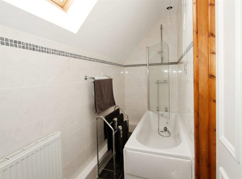 Family bathroom with shower over bath at The Mill House in North Somercotes, near Louth, Lincolnshire
