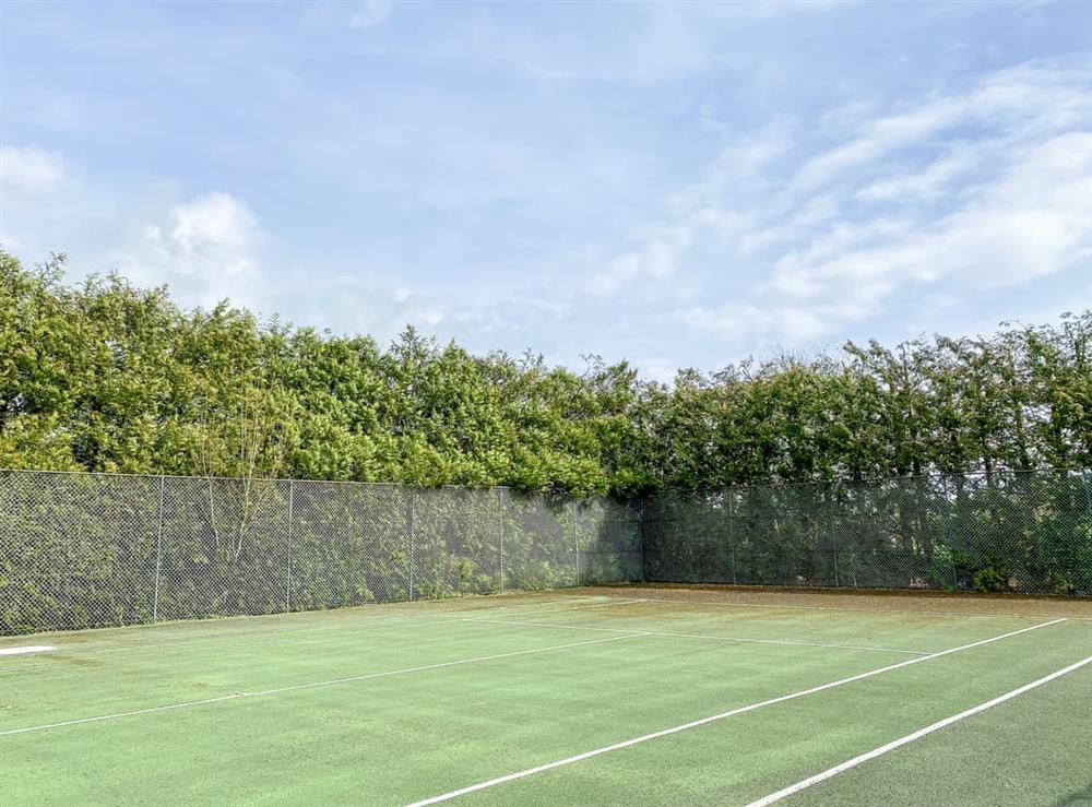 Tennis court at The Mill Lodge in Malmesbury, Wiltshire