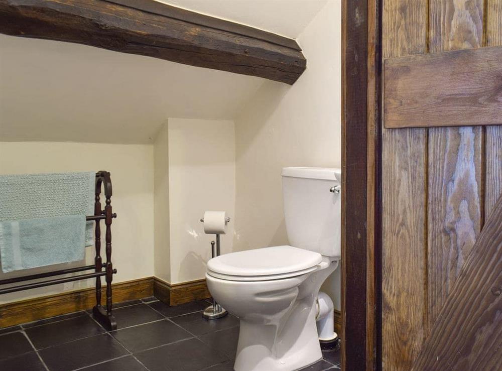 Exposed wood beams in the bathroom at The Mill in Penrith, Cumbria
