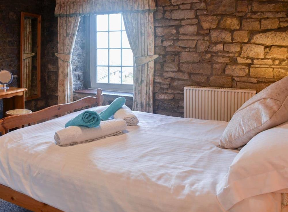 Inviting romantic bedroom at The Mill in West Burton, near Aysgarth, North Yorkshire