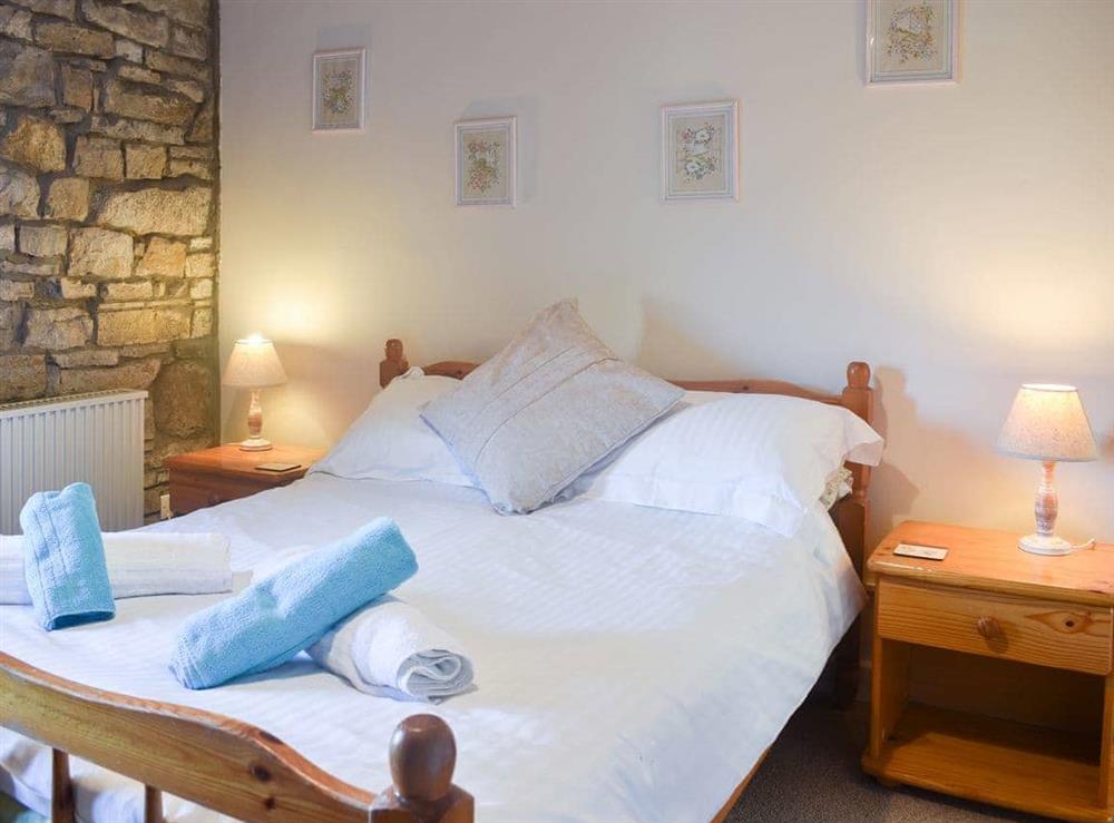 Welcoming bedroom with double bed at The Mill in West Burton, near Aysgarth, North Yorkshire