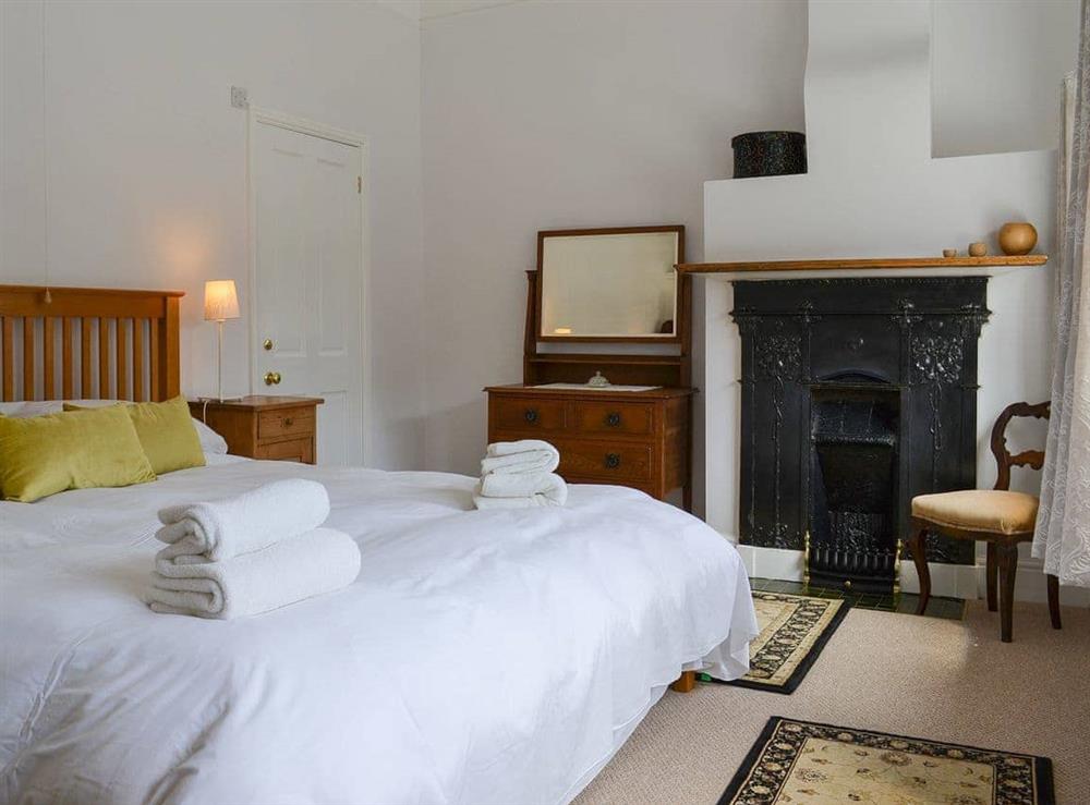 Double bedroom with super kingsize bed at The Mistress House in Hunstanton, Norfolk