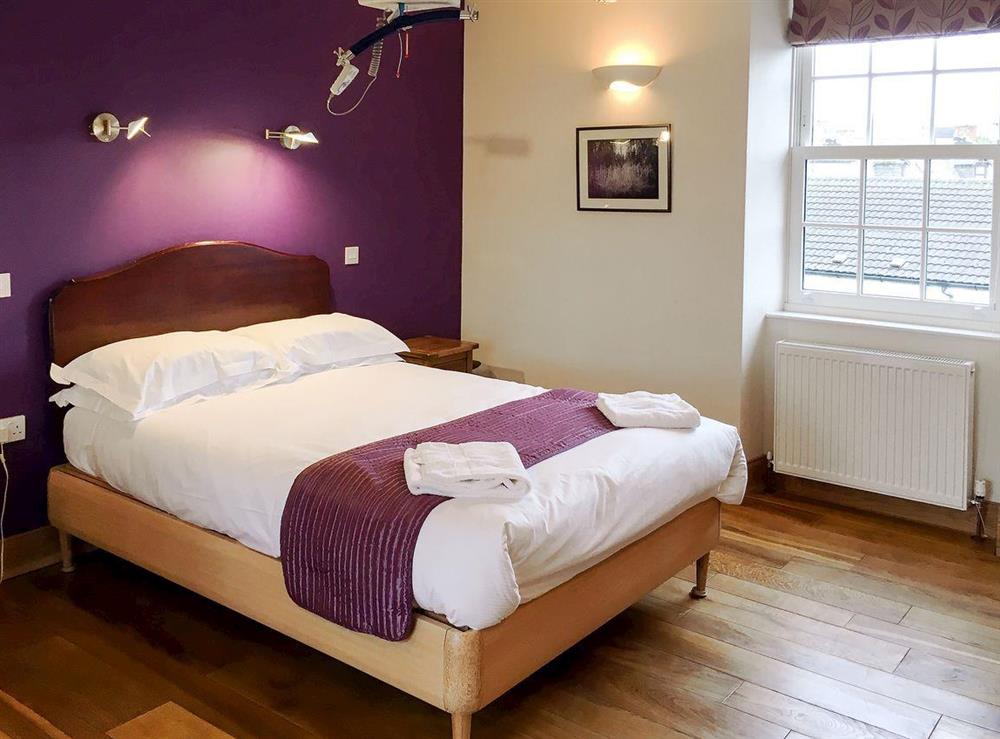 Accessible bedroom featuring x-y ceiling track hoists at The Moat House in Annan, Dumfries & Galloway, Dumfriesshire