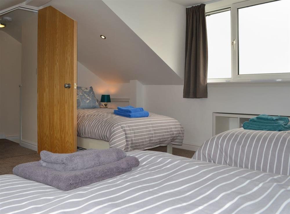 Comfy bedroom with 3 single beds at The Moorings in Grange-over-Sands, Cumbria
