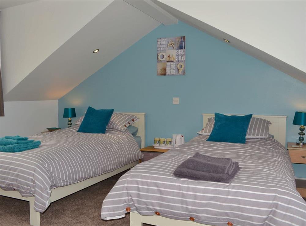 Cosy bedroom with 3 single beds at The Moorings in Grange-over-Sands, Cumbria