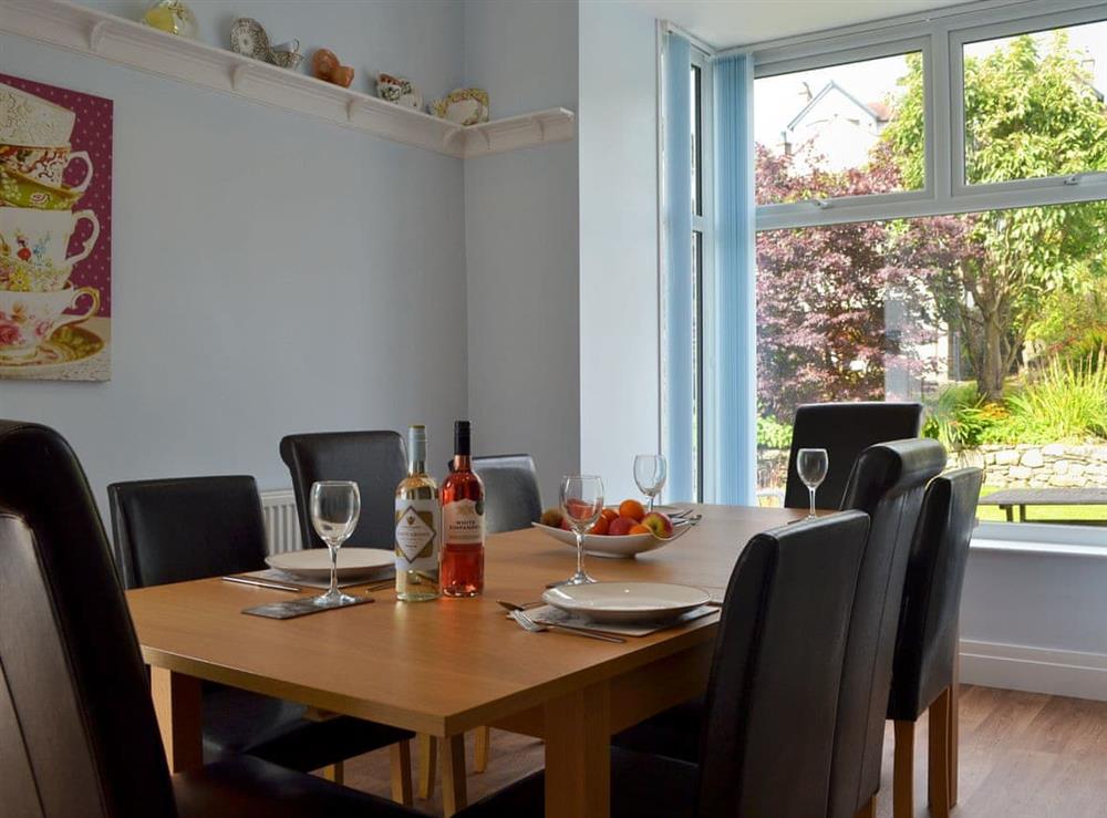 Inviting dining area overlooking the delightful garden at The Moorings in Grange-over-Sands, Cumbria