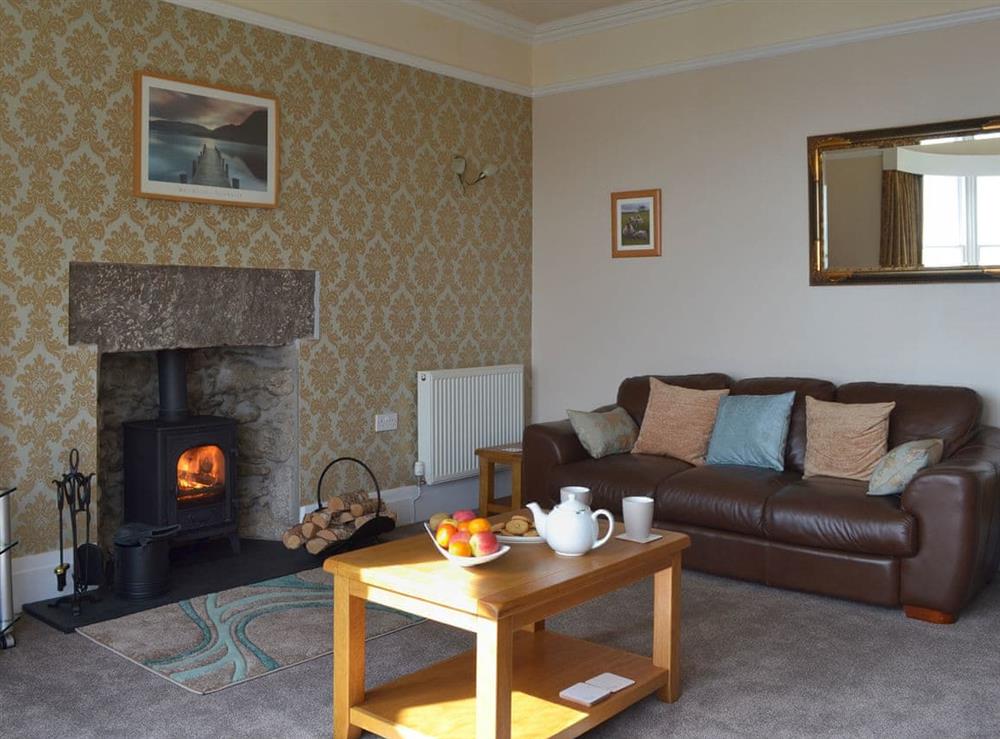 Relaxing lounge with 40” Freesat TV and wood burner at The Moorings in Grange-over-Sands, Cumbria