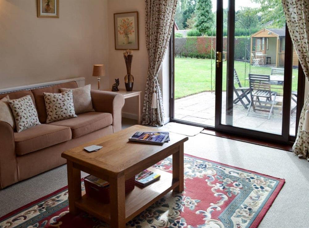 Living room with patio doors at The Mount in Polstead, Essex