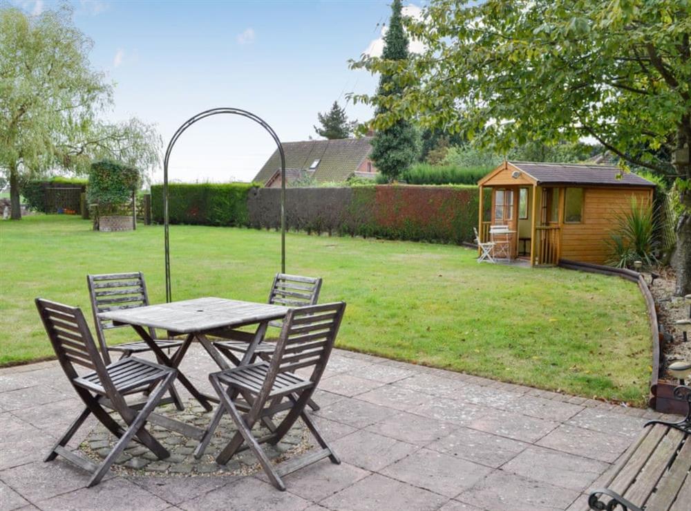 Sitting out area within large lawned garden at The Mount in Polstead, Essex