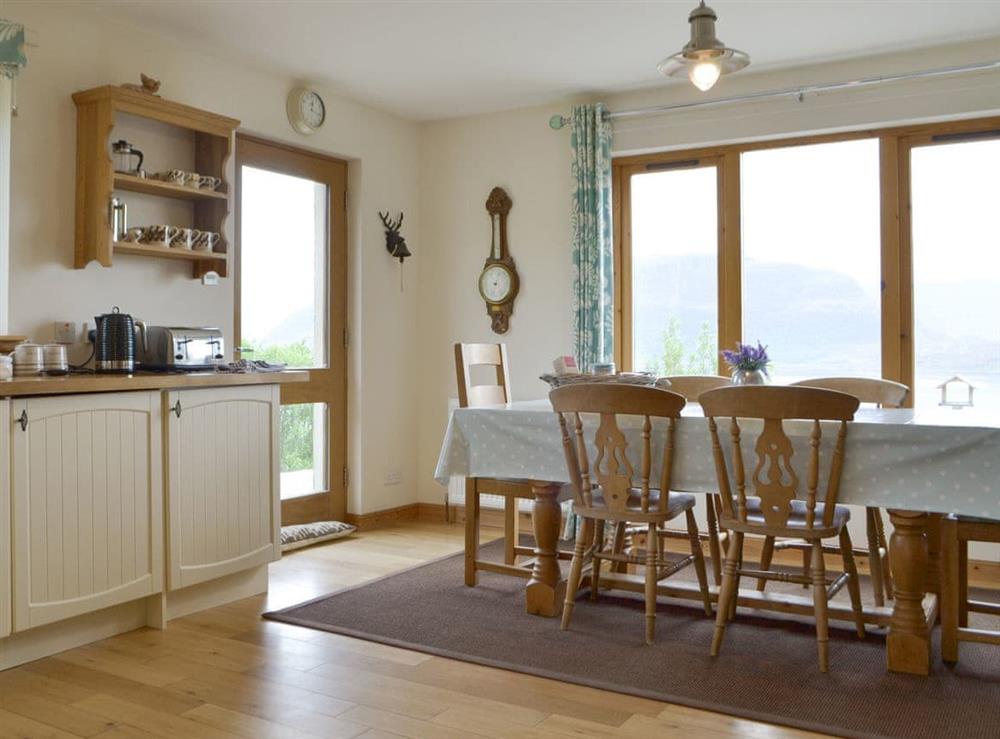 Convenient dining area within living room at The Narrows in Wester Alligin, by Achnasheen, Ross-Shire