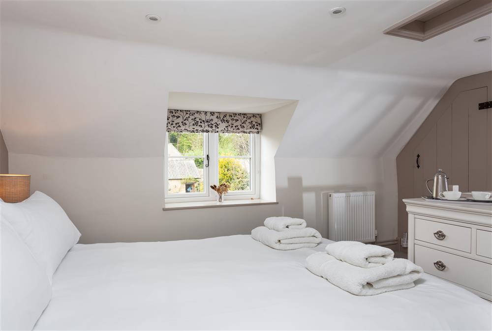 Bedroom three with a 5’ king-size bed (photo 2) at The Nook, Guiting Power