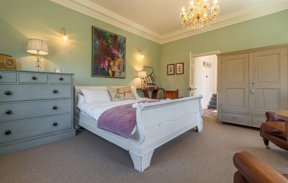 Bedroom one with 6’ super-king bed with french windows looking onto the garden at The Normans, Wells-next-the-Sea