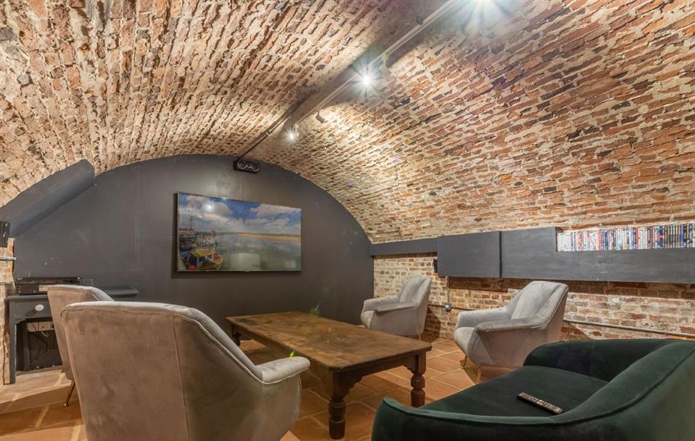 Brick vaulted cinema room with 75 inch Smart television and DVD player at The Normans, Wells-next-the-Sea