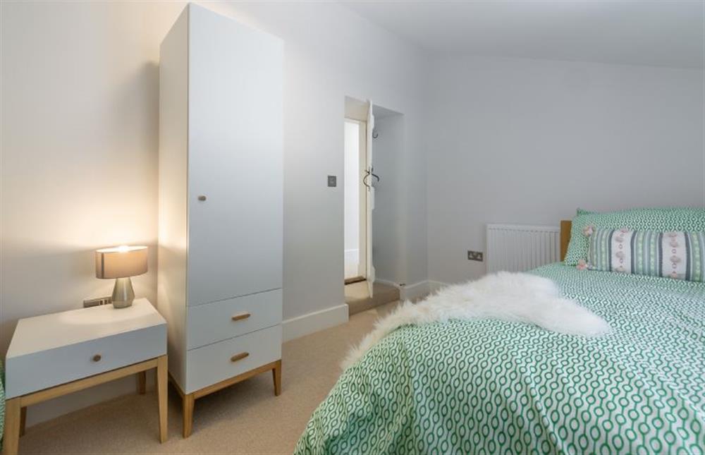 Ground floor: Bedroom three with full-size twin beds and wardrobe at The Nurseries, Syderstone near Kings Lynn