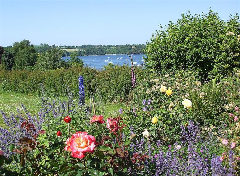 A summer garden and beautiful view at The Old Bakehouse, Dittisham