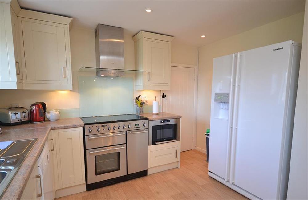 The kitchen boasts a range oven as well as an American fridge freezer at The Old Bakehouse, Dittisham