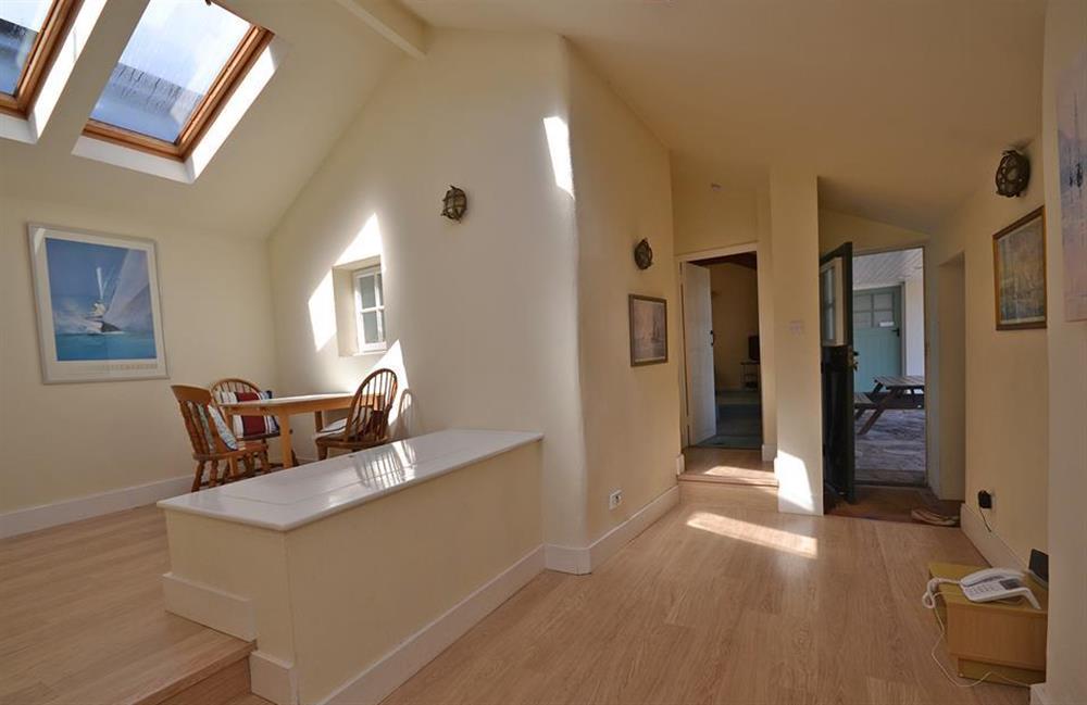 The light and airy entrance hall which incorporates a play area with toy box at The Old Bakehouse, Dittisham