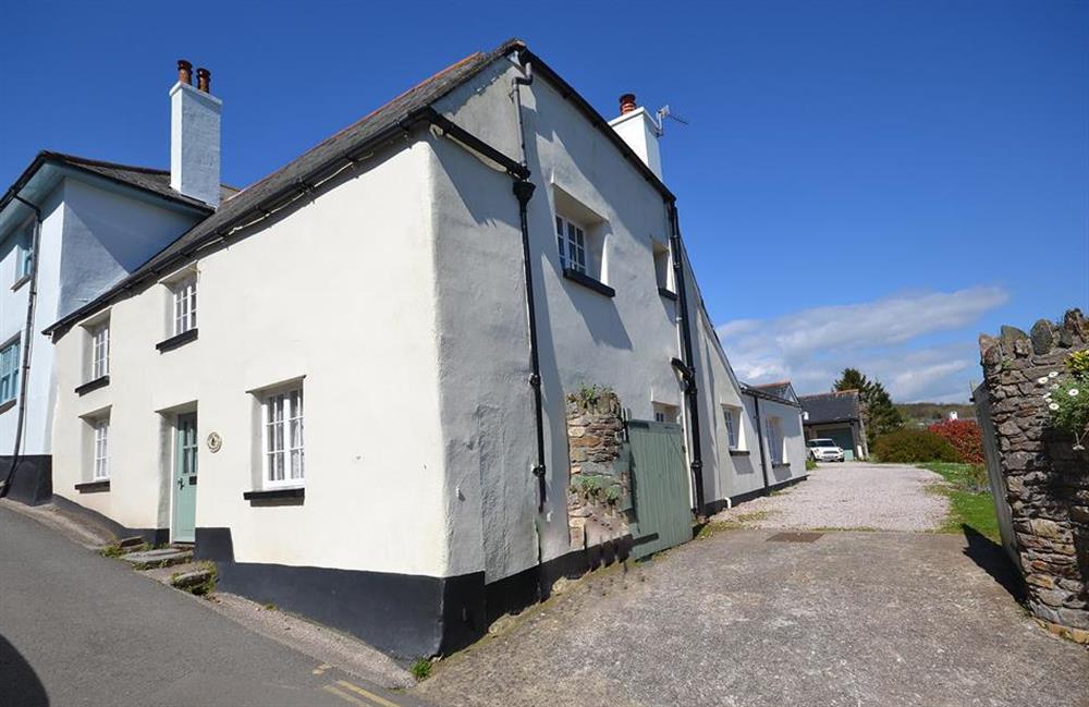 The side entrance to the cottage. Gates can be closed to enclose the garden at The Old Bakehouse, Dittisham