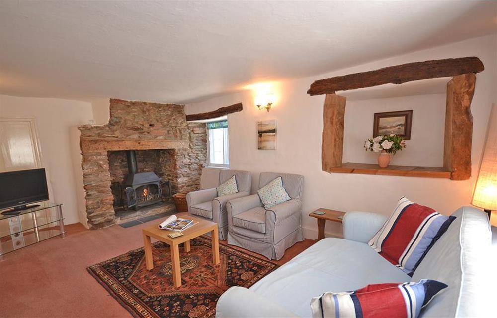 The 'winter' sitting room with a wood burning stove at The Old Bakehouse, Dittisham