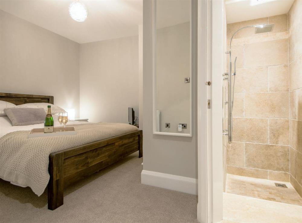 Double bedroom with ideal en-suite shower room at The Old Bakery in Whitby, North Yorkshire