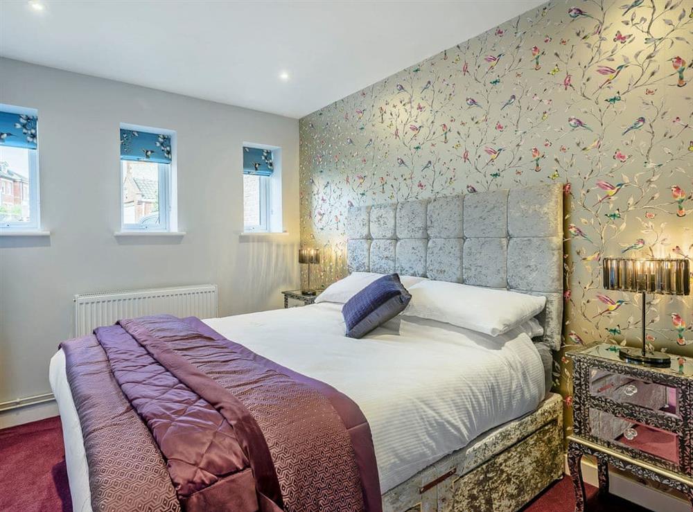 Tastefully furnished double bedroom with en-suite toilet at The Old Bank in Mundesley, near North Walsham, Norfolk