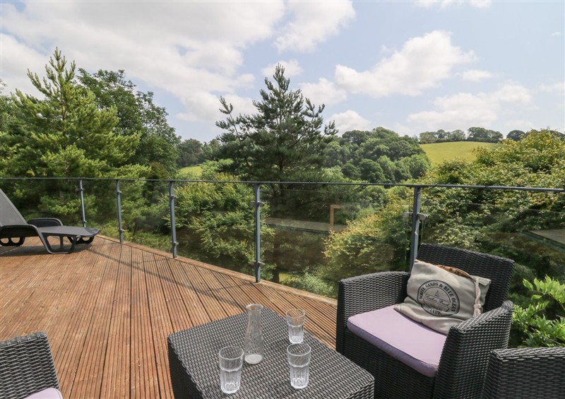 Enjoy a glass of wine on the patio at The Old Barn, Ciliau Aeron near Aberaeron