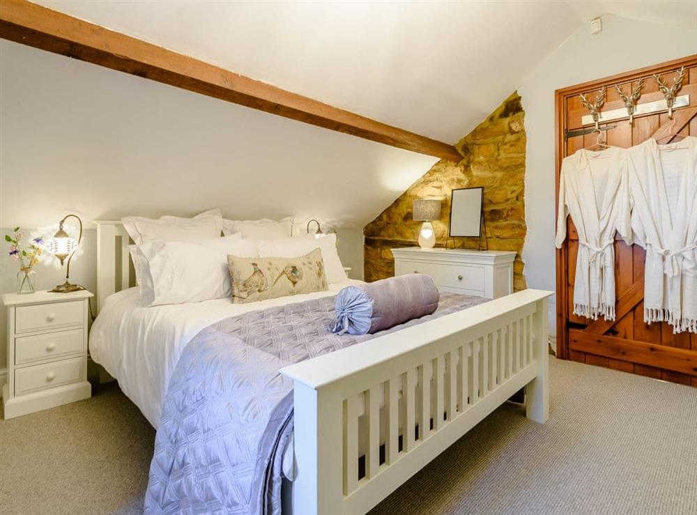 Master bedroom at The Old Barn in Cloughton, near Scarborough, North Yorkshire