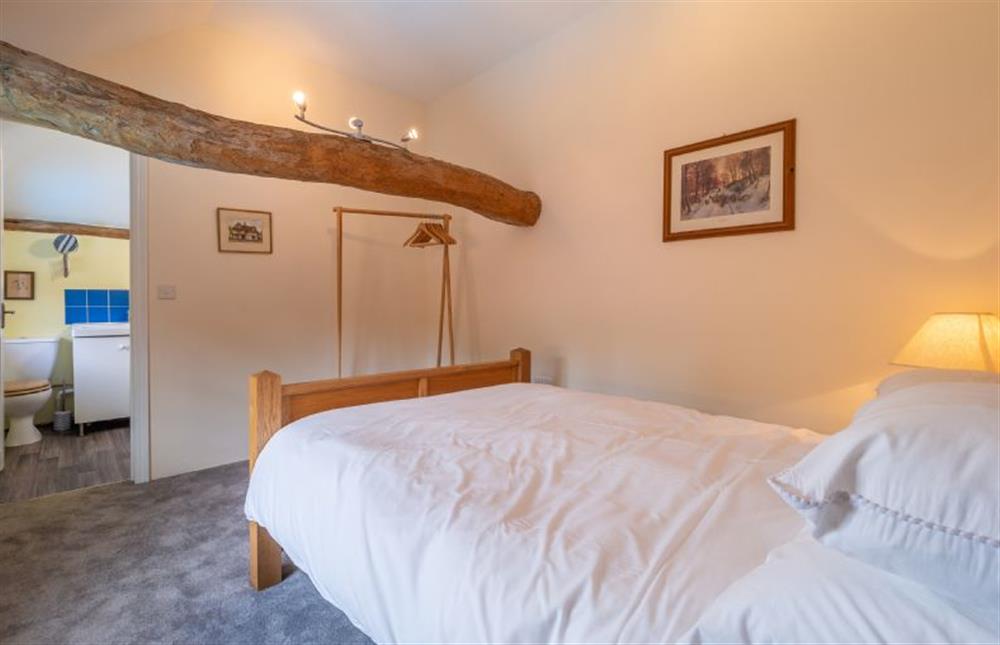 Bedroom two with a double bed and a Jack and Jill shower room access at The Old Barn, Semer