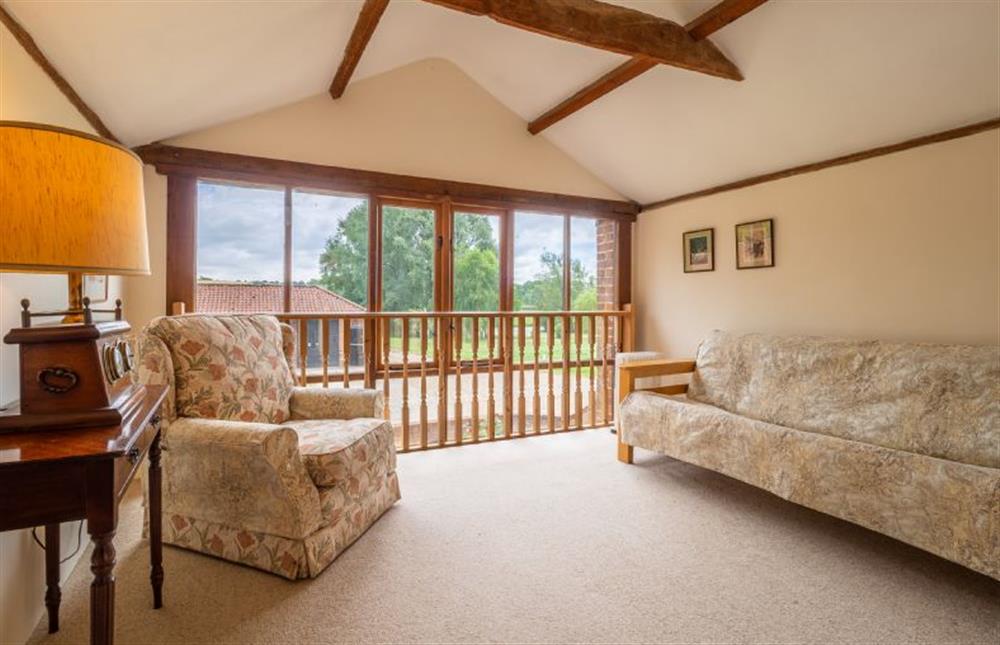 Sun room with views over the pastures at The Old Barn, Semer