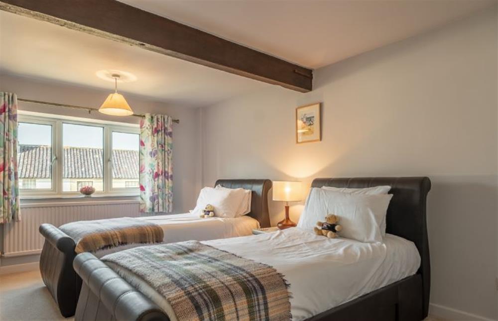 First floor: Bedroom three with two 3ft single beds at The Old Barn, Weybourne near Holt