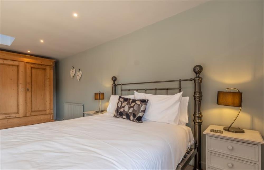 First floor: Master bedroom  at The Old Barn, Weybourne near Holt