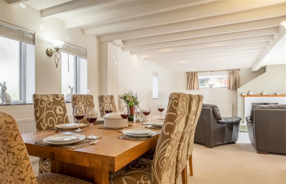 Ground floor: Dining table back to the sitting room at The Old Barn, Weybourne near Holt