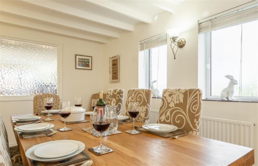Ground floor: Dining table with seating for seven guests at The Old Barn, Weybourne near Holt