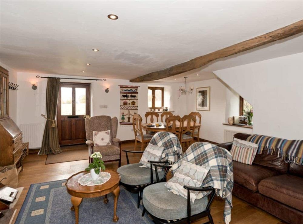 Spacious living room with dining area at The Old Bothy in Watermillock, near Ullswater, Cumbria