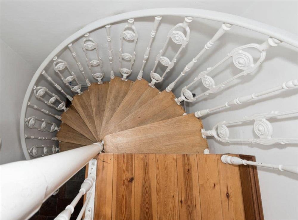 Spiral staircase to ground floor at The Old Bothy in Watermillock, near Ullswater, Cumbria
