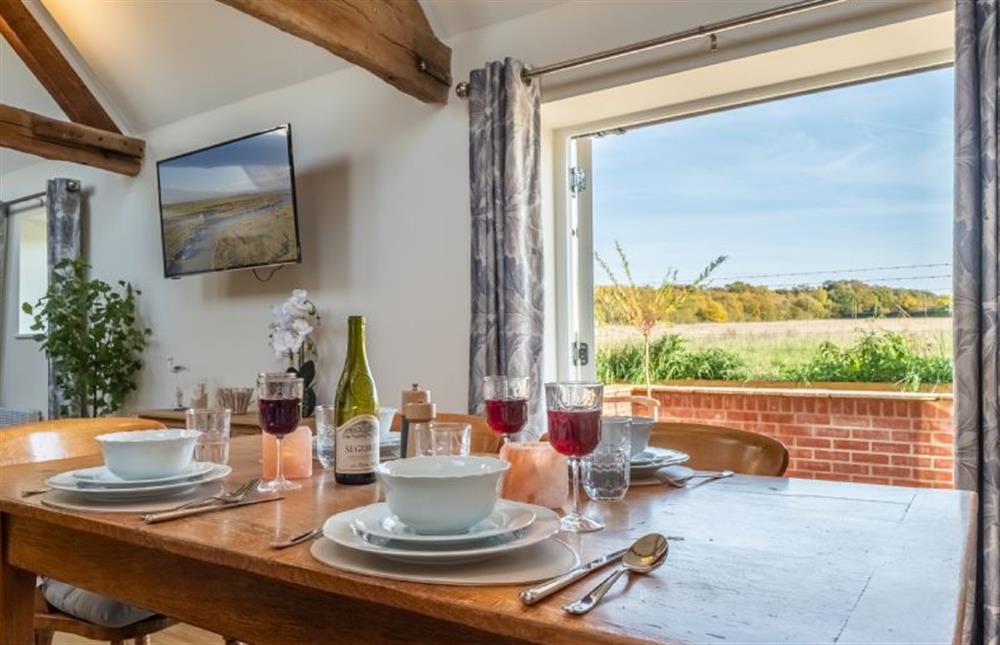 Dining table with seating for at least four at The Old Bunkhouse, Ringstead near Hunstanton