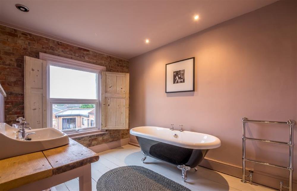 First floor: Bathroom with double-ended freestanding bath at The Old Butchers Shop, Heacham near Kings Lynn