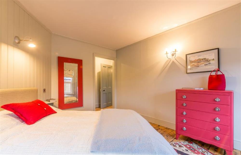 First floor: Double bed in bedroom three at The Old Butchers Shop, Heacham near Kings Lynn