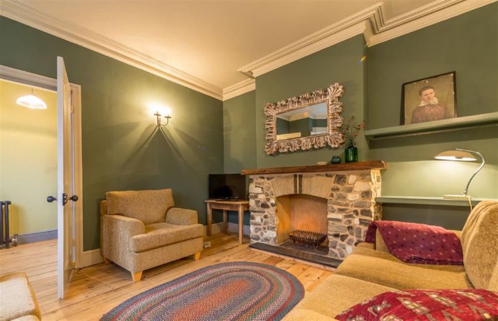 Ground floor: The sitting room has a feature fireplace at The Old Butchers Shop, Heacham near Kings Lynn