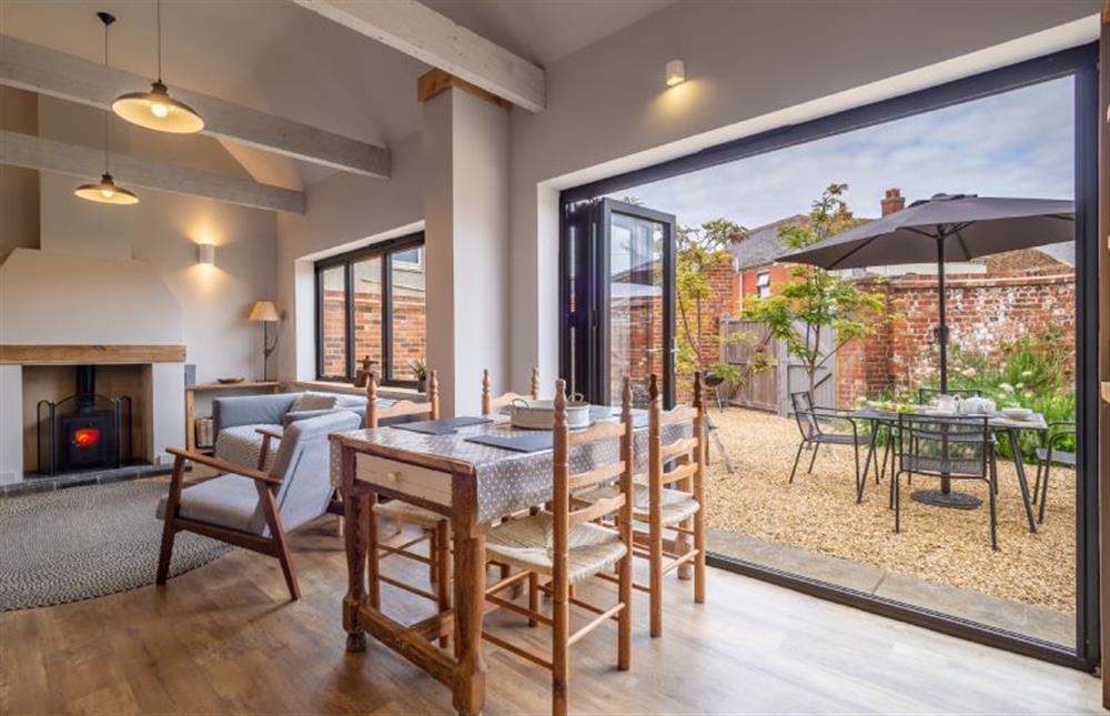 Ground floor: The dining area has bi-fold doors to the courtyard garden at The Old Butchers Stores, Heacham near Kings Lynn