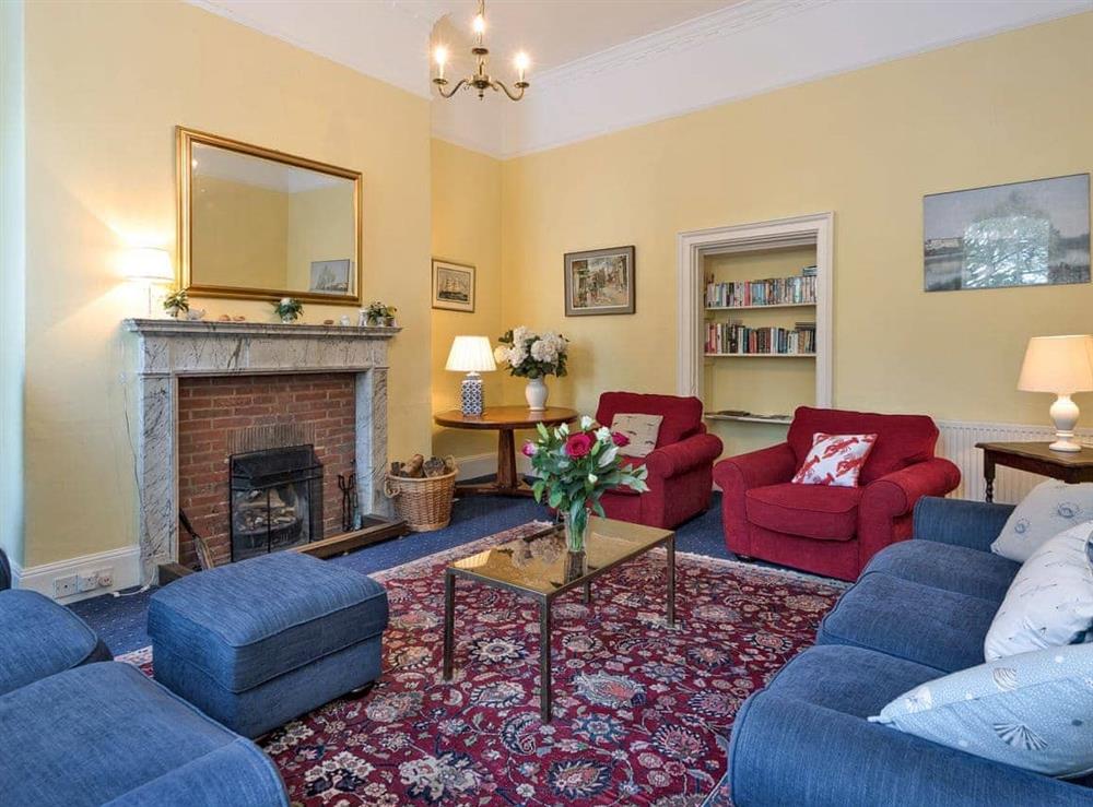 Attractive living room with an open fire (photo 2) at The Old Butlers House in Cley-next-the-Sea, Norfolk., Great Britain